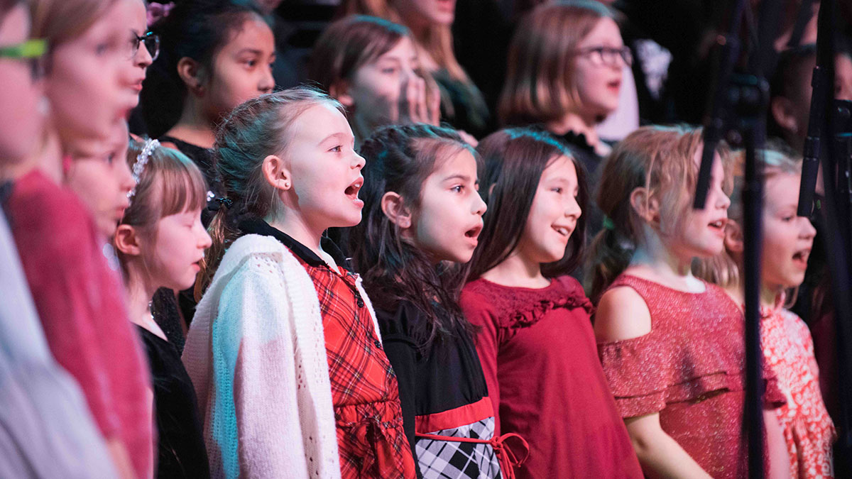 A children choir group singing
