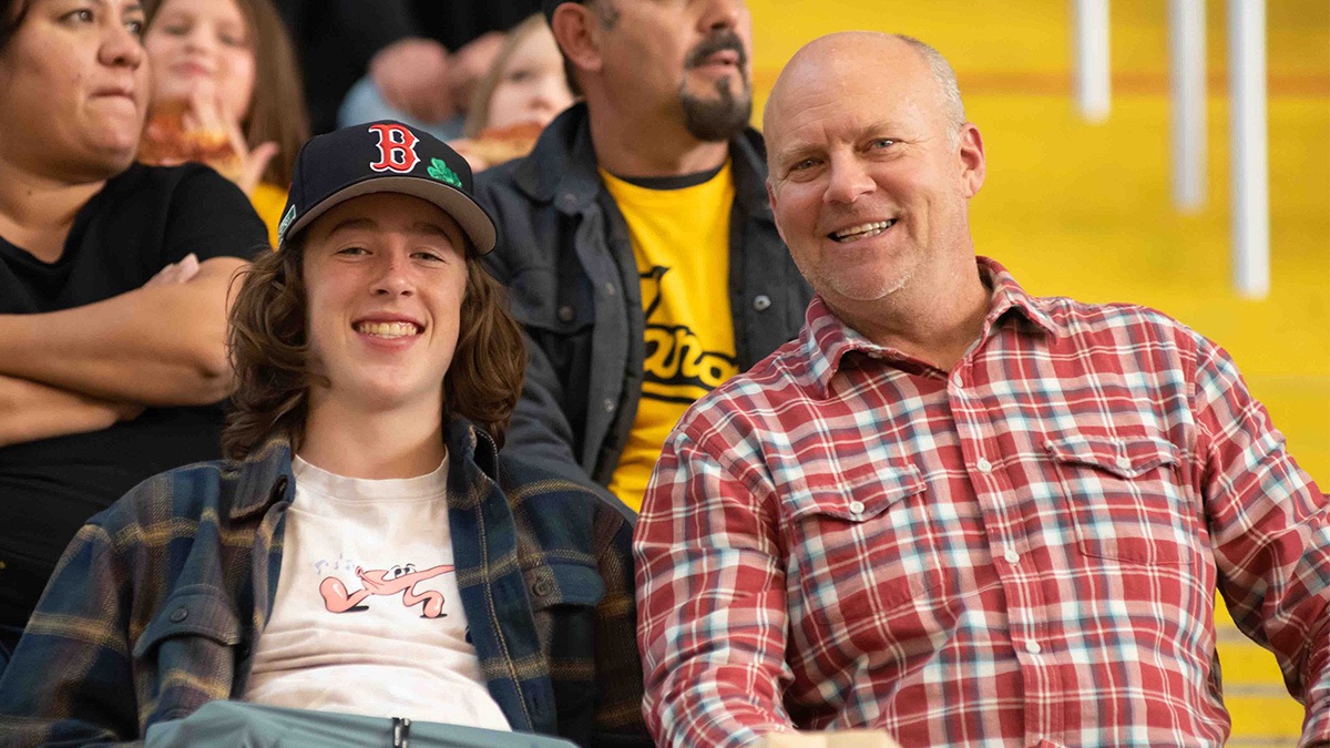 Two men smiling and looking happy