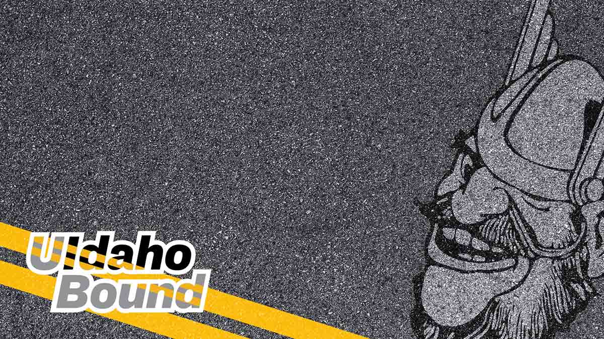 Asphalt texture background with words UIdaho Bound and image of Joe Vandal