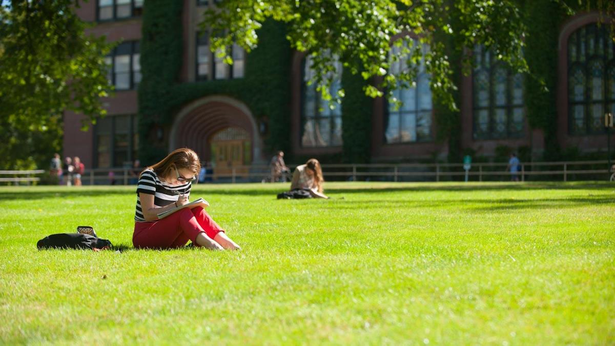Student studying on Admin Lawn