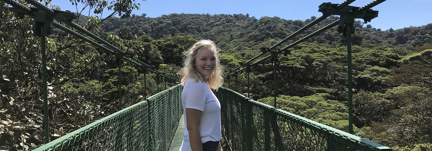 Kaylee Nye poses on a bridge in the cloud forest of Monteverde, Costa Rica
