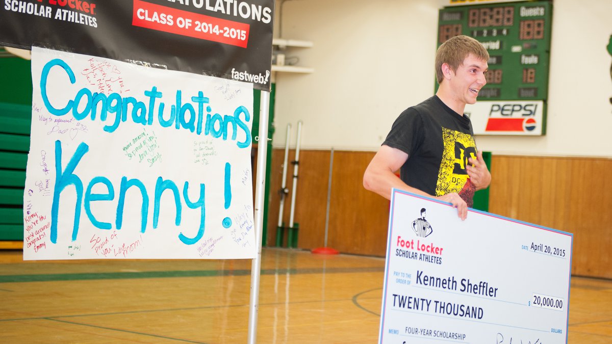 Kenny Sheffer showing an emotional display of gratitude after receiving a $20,000 scholarship.