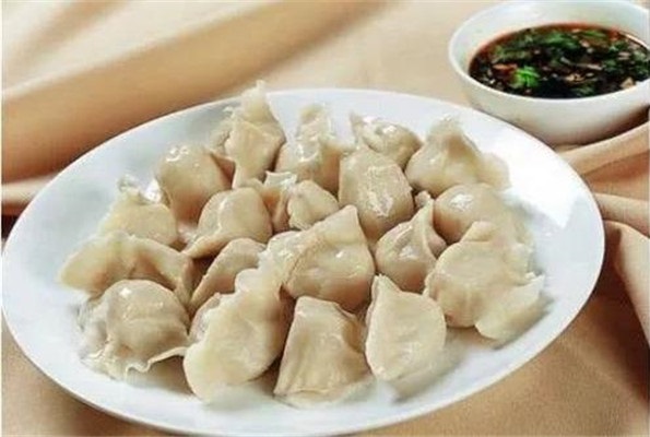 Dumplings with soy sauce.