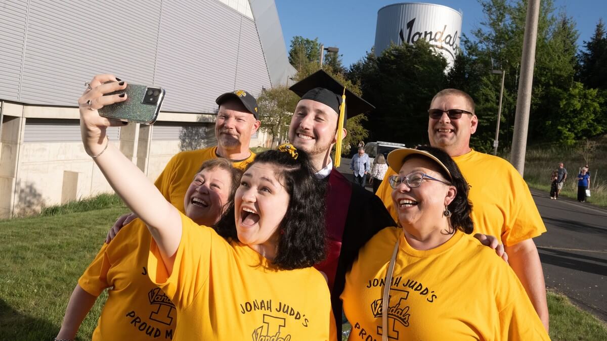 Family celebrating graduation with their new Vandal alum.