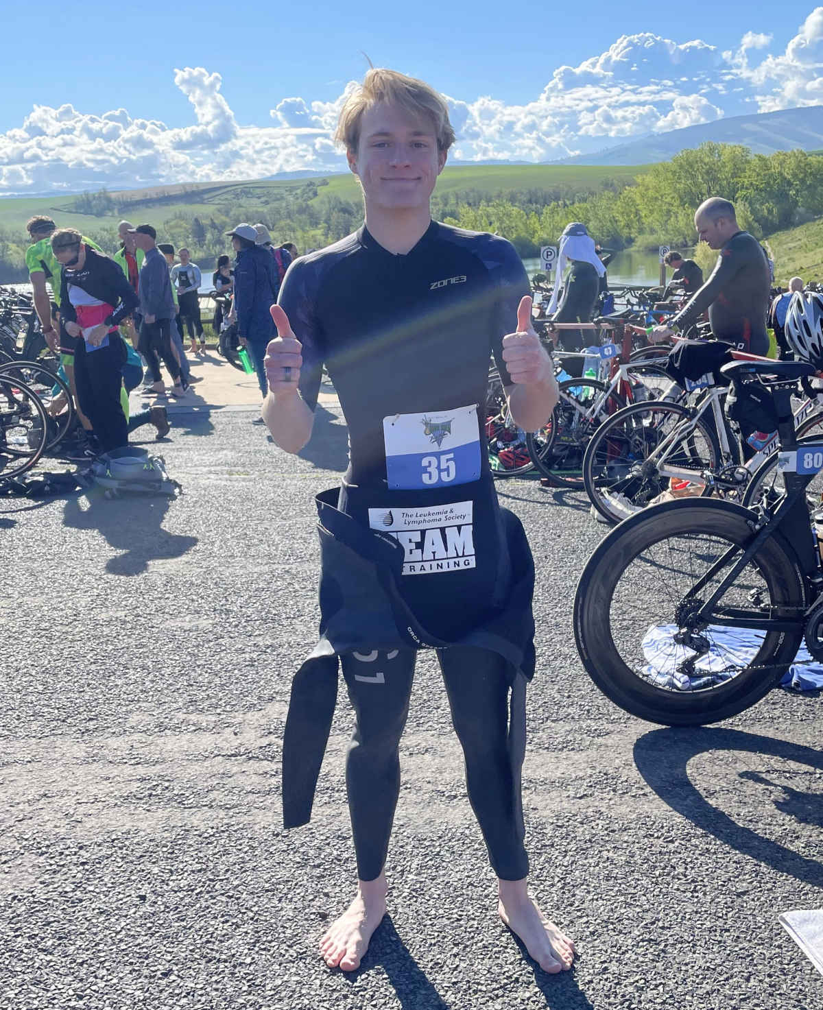 University of Idaho student Ethan Sunseri smiling with two thumbs up after marathon training