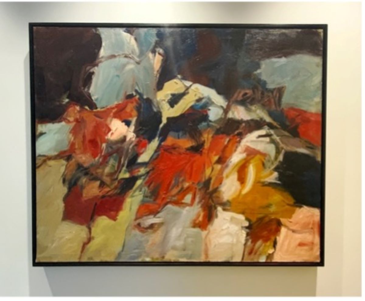 An abstract painting of white, yellows, blues and reds smudged and blended together.