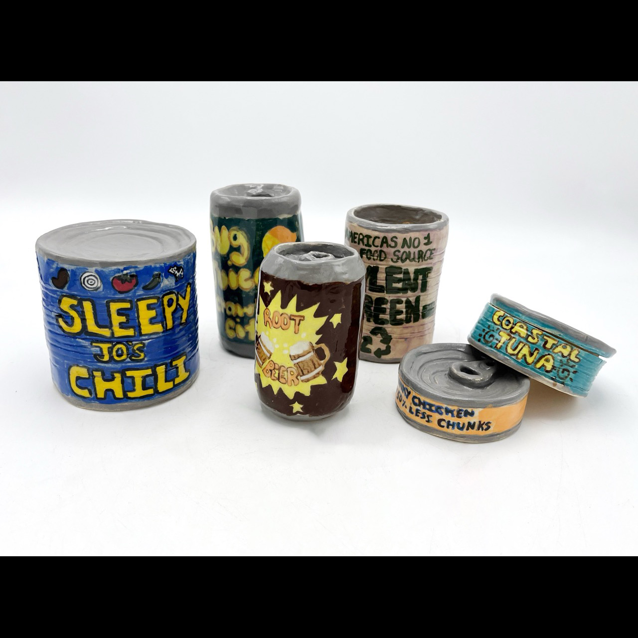 Cans of various types in various shapes and sizes, made out of clay.