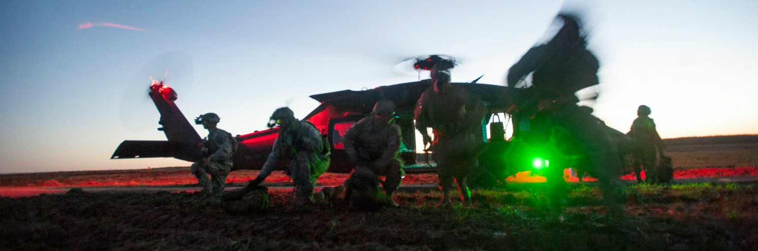 Soldiers exit a UH-60 Blackhawk.