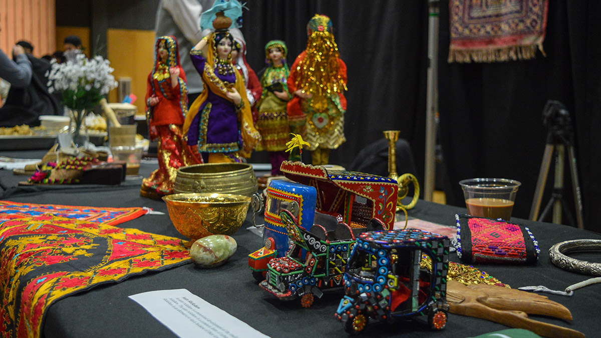 Small, decorated replicas of Auto Rickshaws or tuk-tuks, as well as embossed gold bowls, tapestries, a wood carving and the flag of Pakistan.