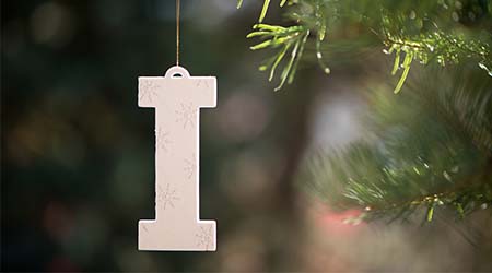 "I" logo on a pine tree for the holidays.