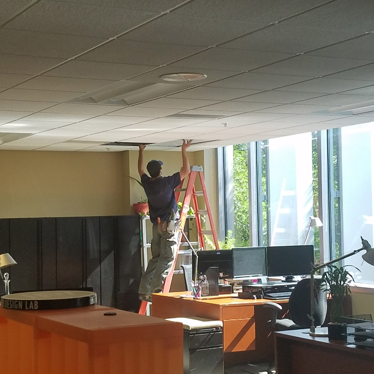 Facilities installs the new lights in the U of I Integrated Design Lab.