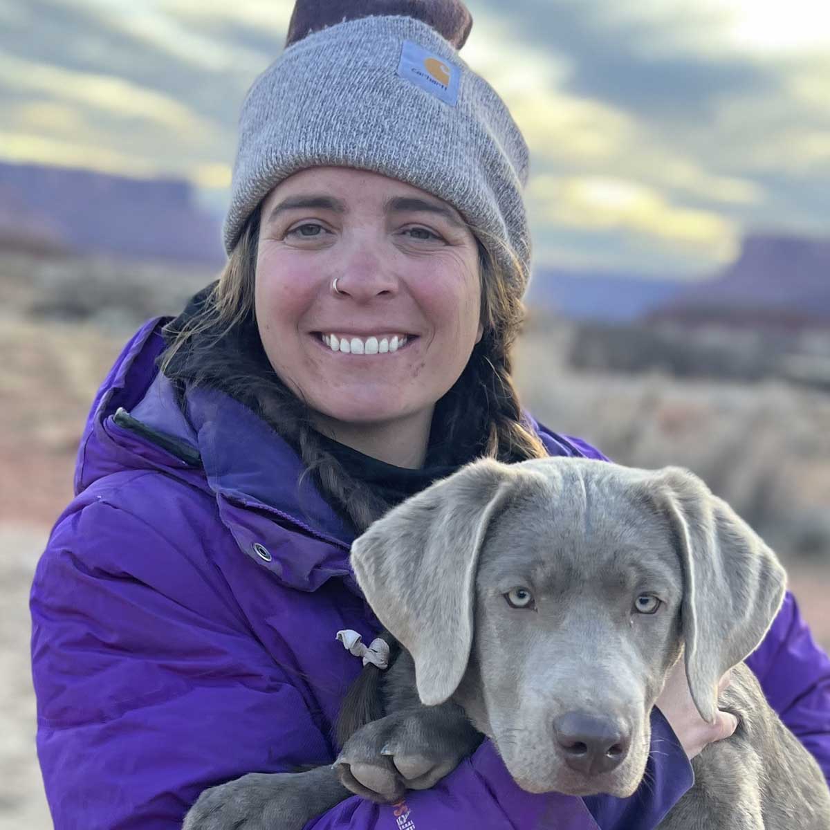 Portrait of a woman holding a dog