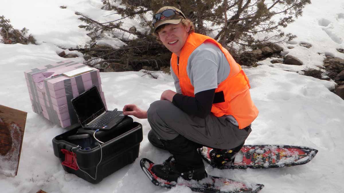 Ryan Niemeyer wears snowshoes while collecting field data for his dissertation