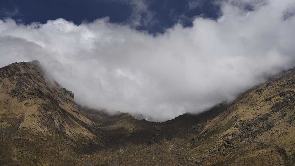 clouds over mountain valley