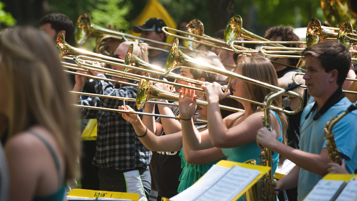 Trombonists practice on the Admin lawn.