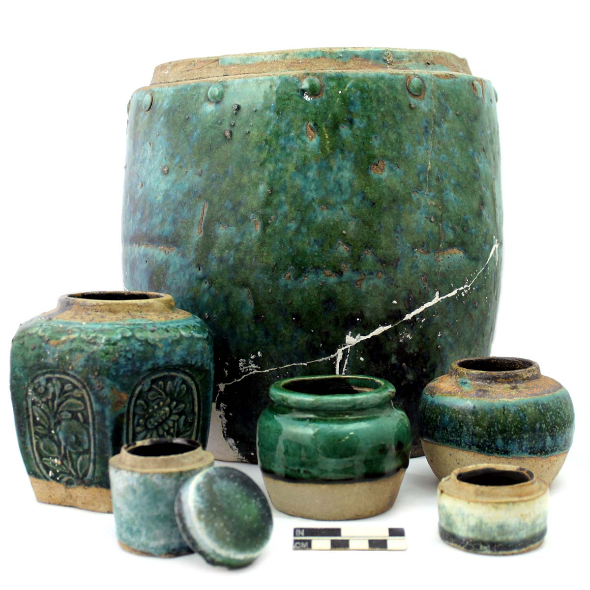 Barrel jar (top) and other green glazed stonewares.