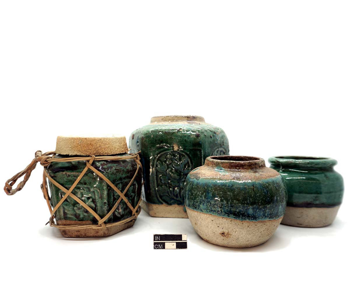 Ginger jars and lid, green-glazed stoneware. The left two are hexagonal.