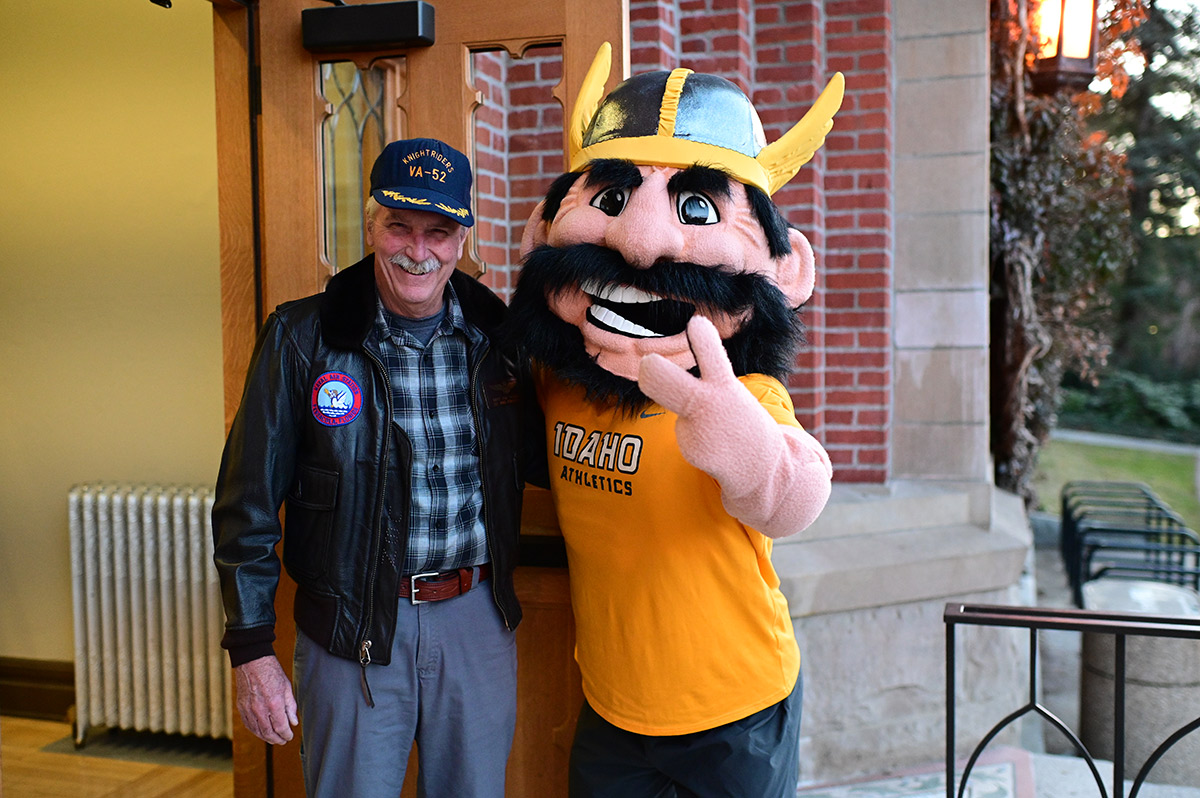 Joe Vandal poses with a retired veteran at the Memorial Gym doors.