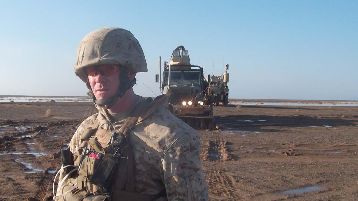 SSgt Michael Clark with a truck in the background