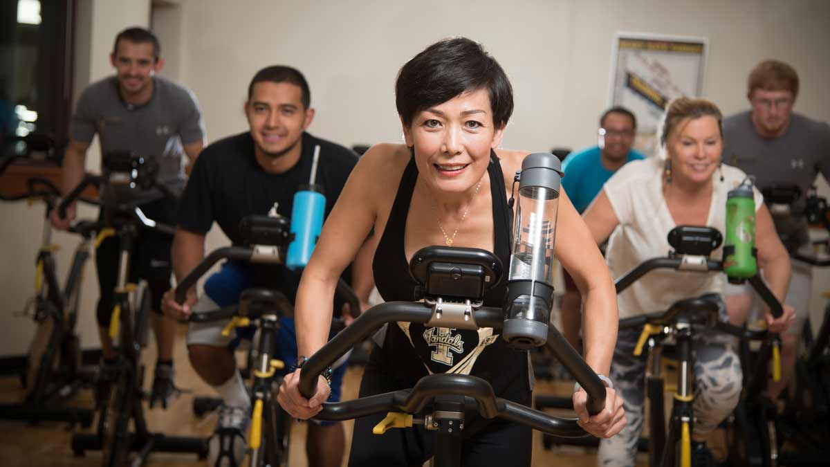 Students attending a spinning class