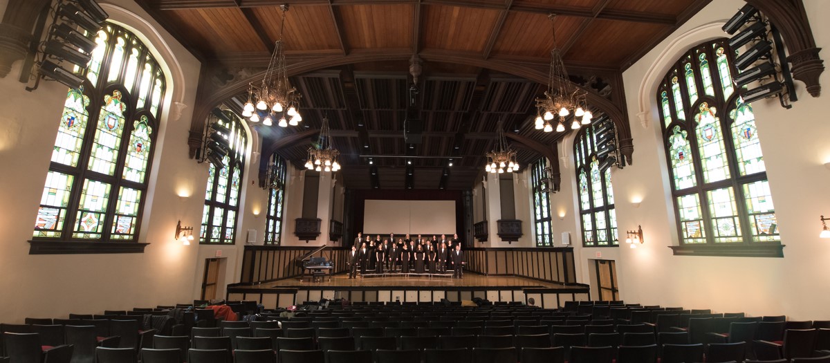 Vandal Choir on stage in the otherwise empty Administration Auditorium