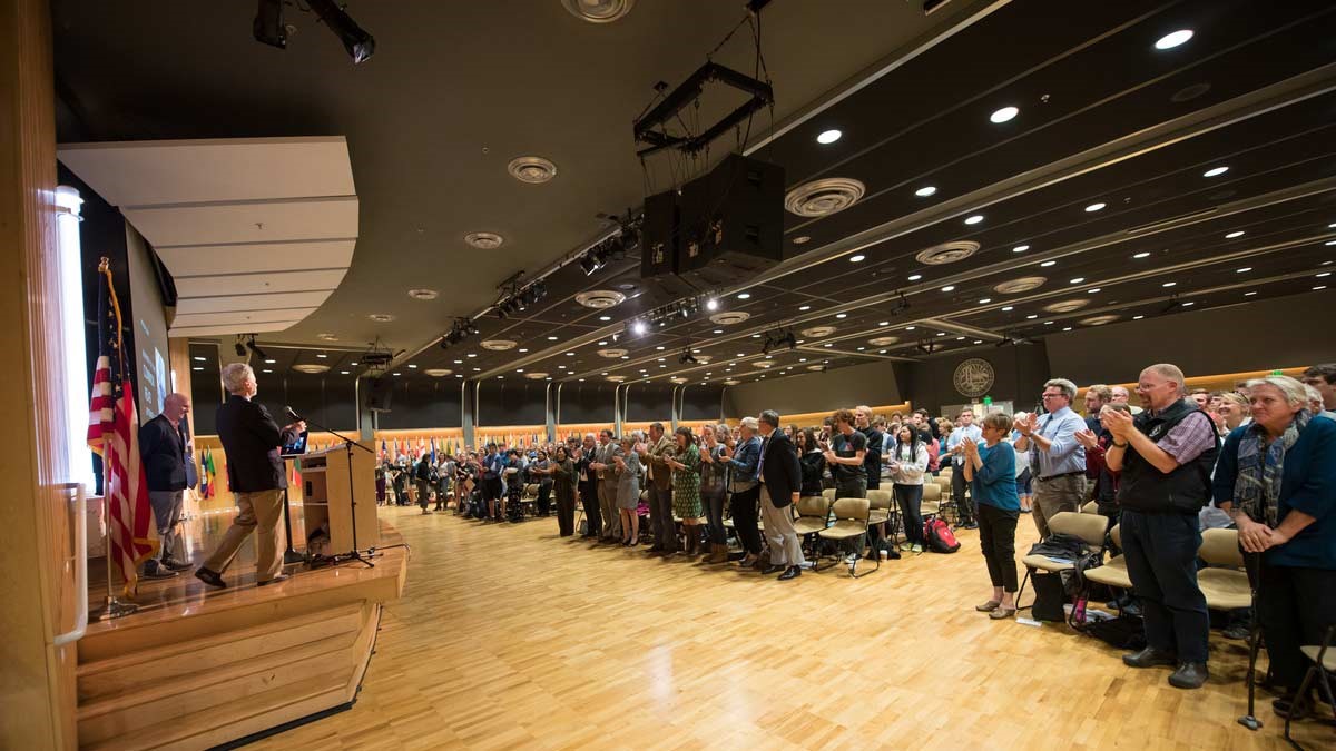 Audience applauds speaker in the International Ballroom