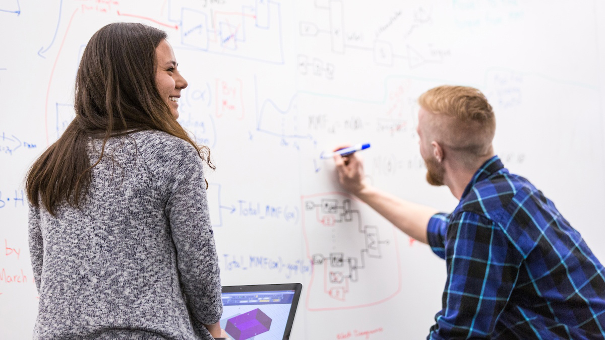 Students use a whiteboard in the IRIC.