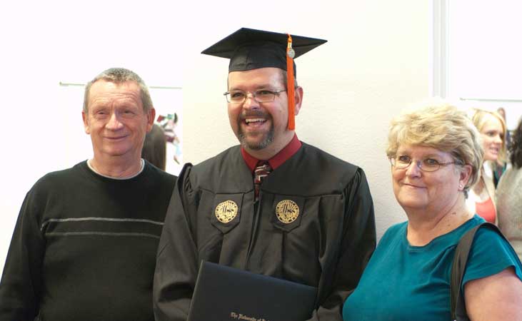 Greg Austin with family at graduation.