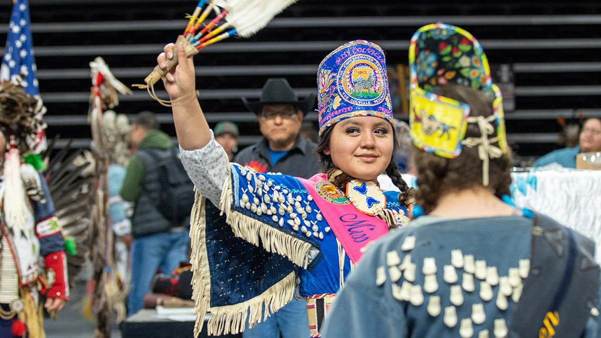 A woman dressed in a cultural outfit during the Tutxinmepu Powwow event