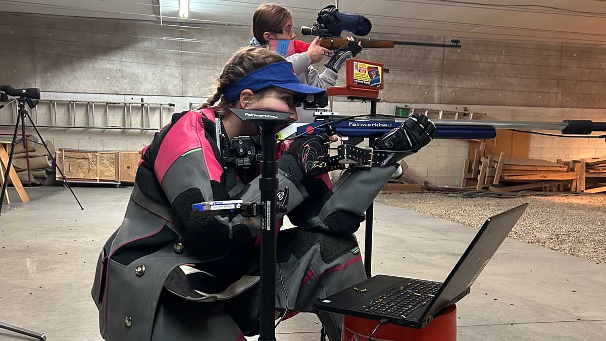 Women shooting rifles to prep for the olympics