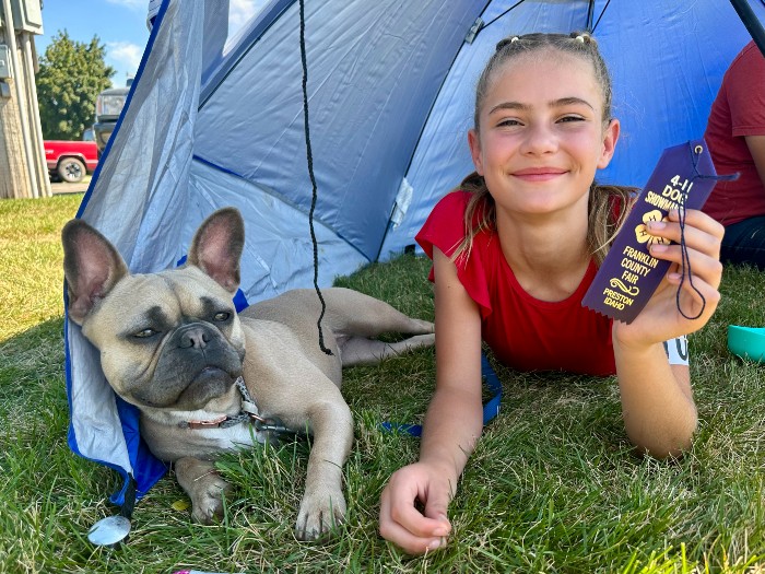 girl posing with dog 