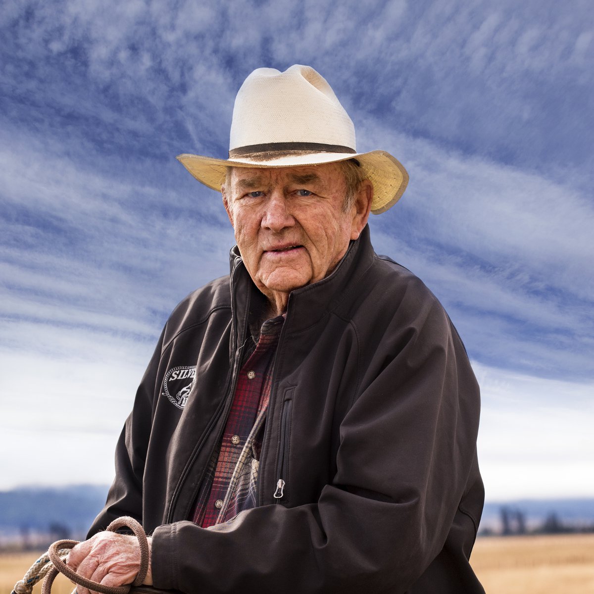 Harry L. Bettis sits on horseback at his southern Idaho cattle ranch.