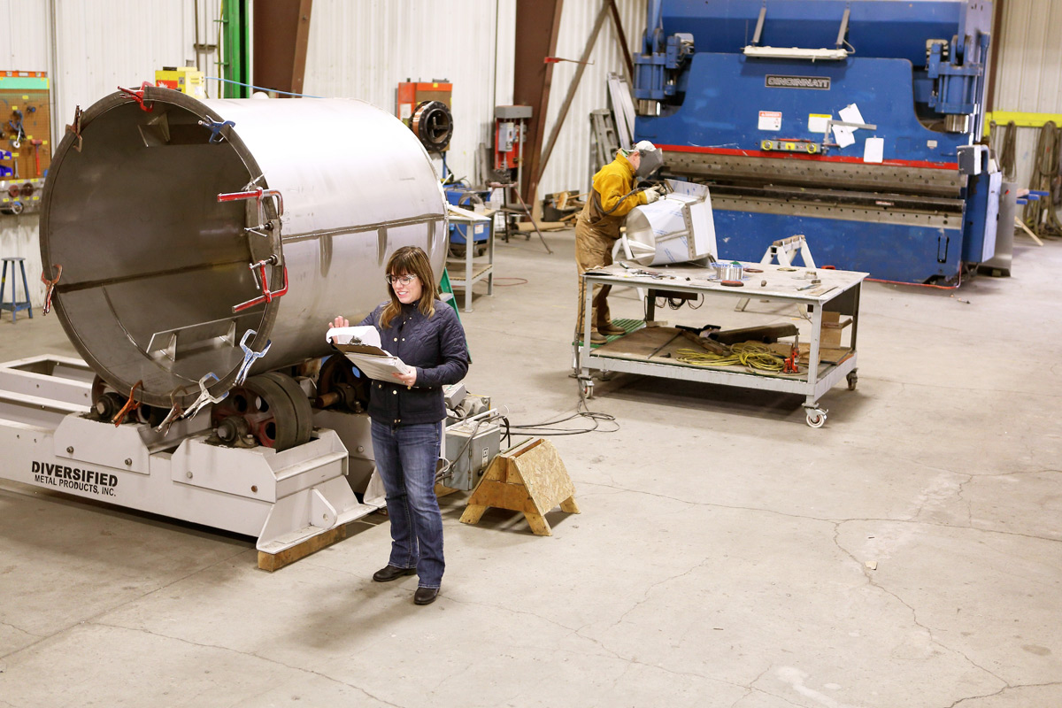 Rebecca McClellan inspects production in the workshop at Diversified Metal Products in Idaho Falls.