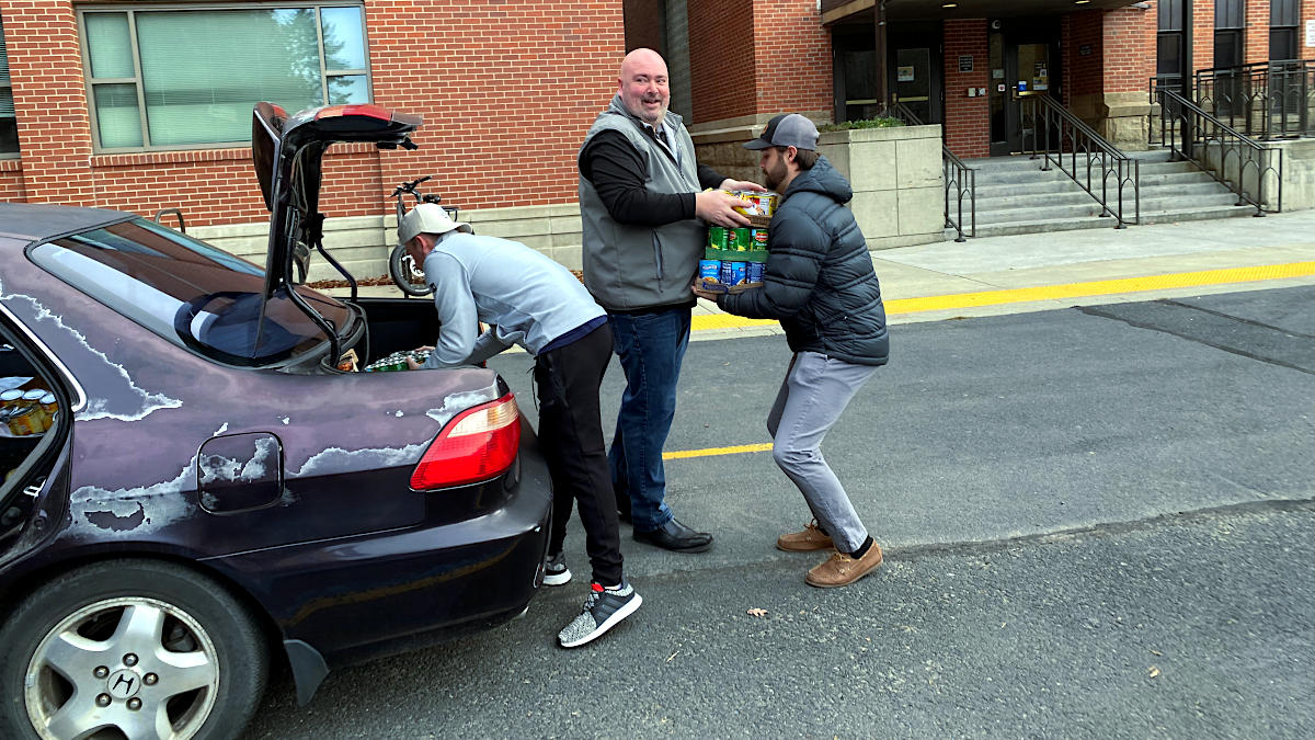 University of Idaho students unload food donation from Zoe Evans’ car.