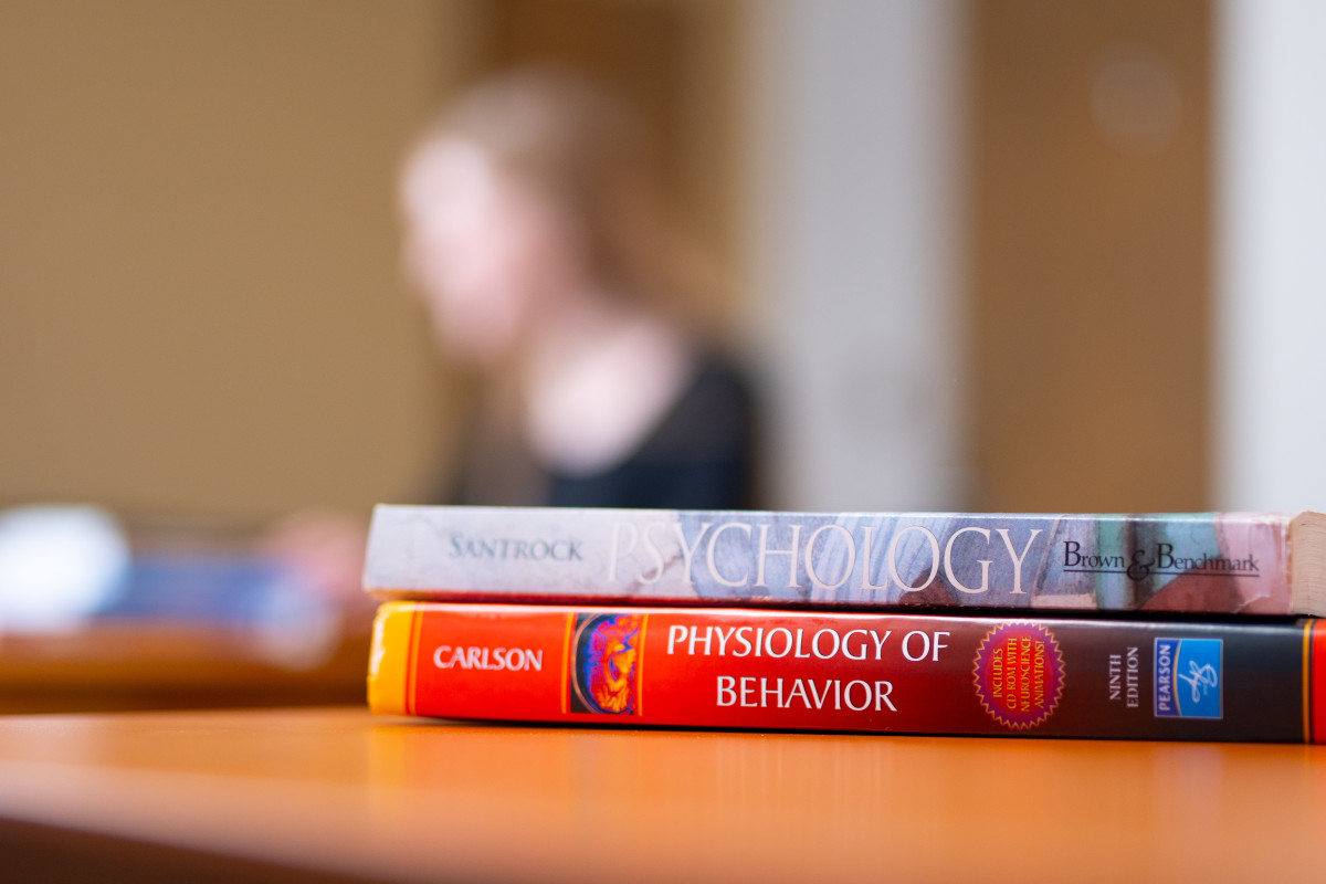 Psychology textbooks on a table.