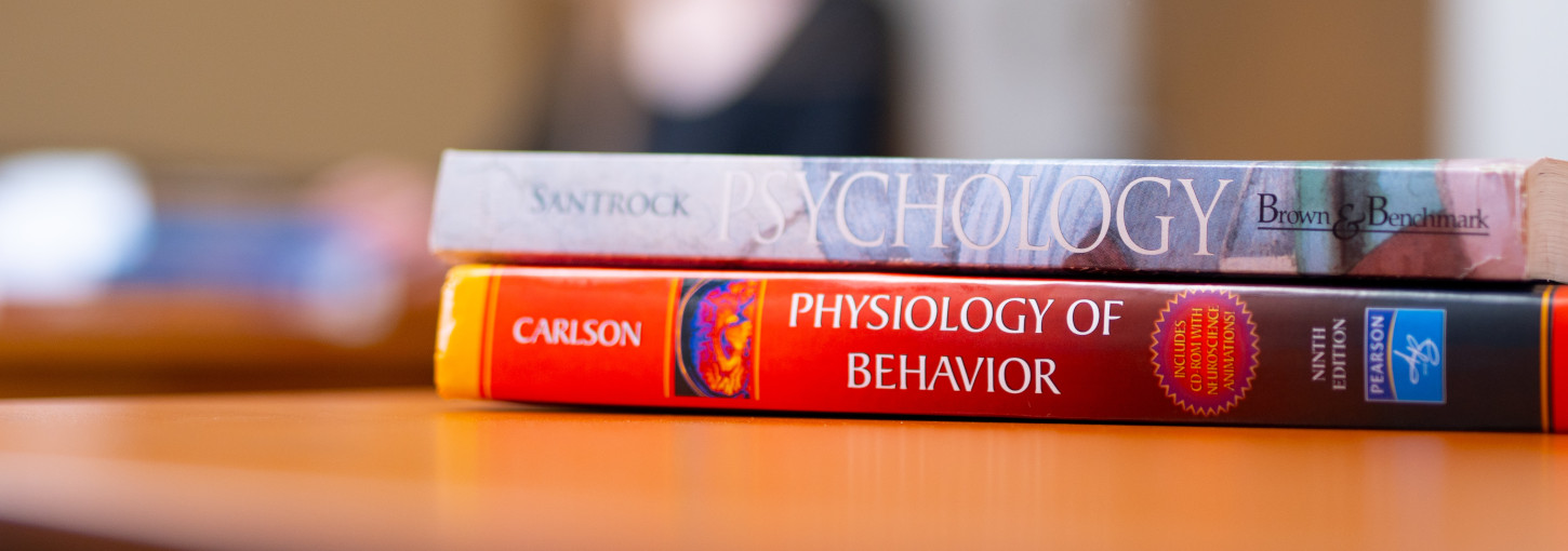 Psychology textbooks on a table.