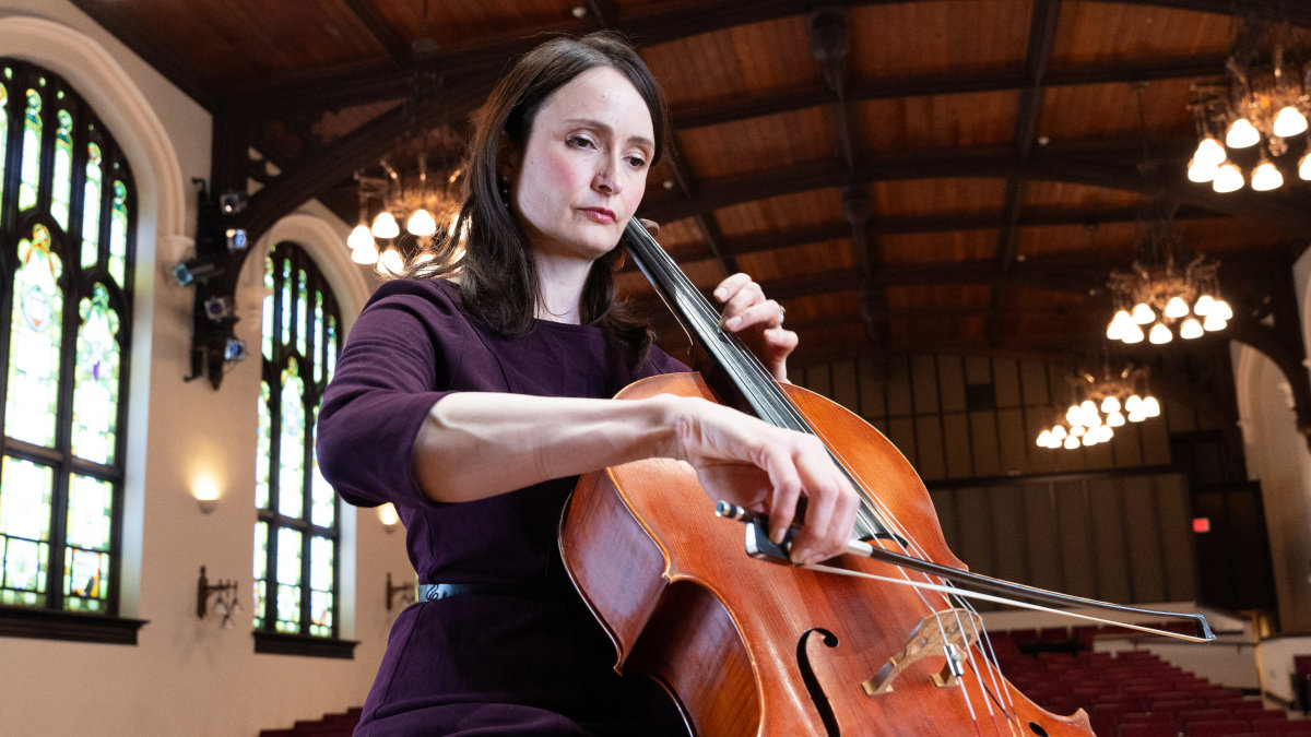 Wilson draws a bow across cello strings.