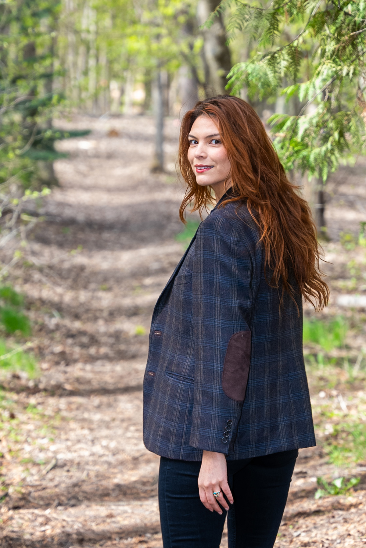 Celilo Miles walking down a tree lined path.