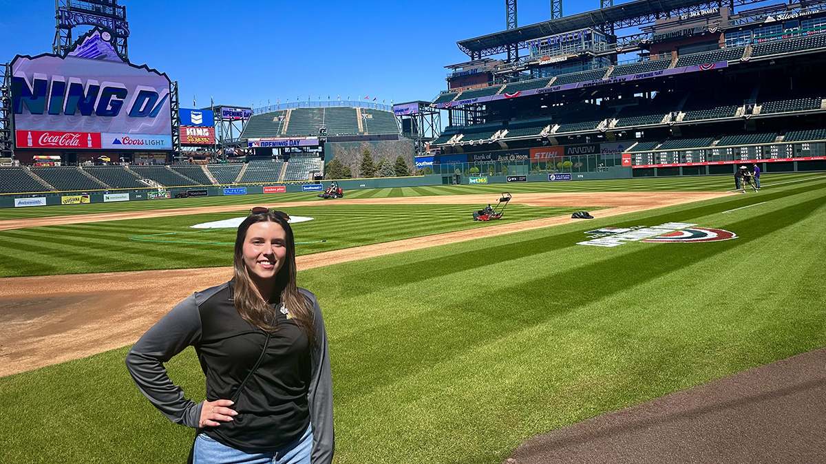 Photo of woman on a baseball field.