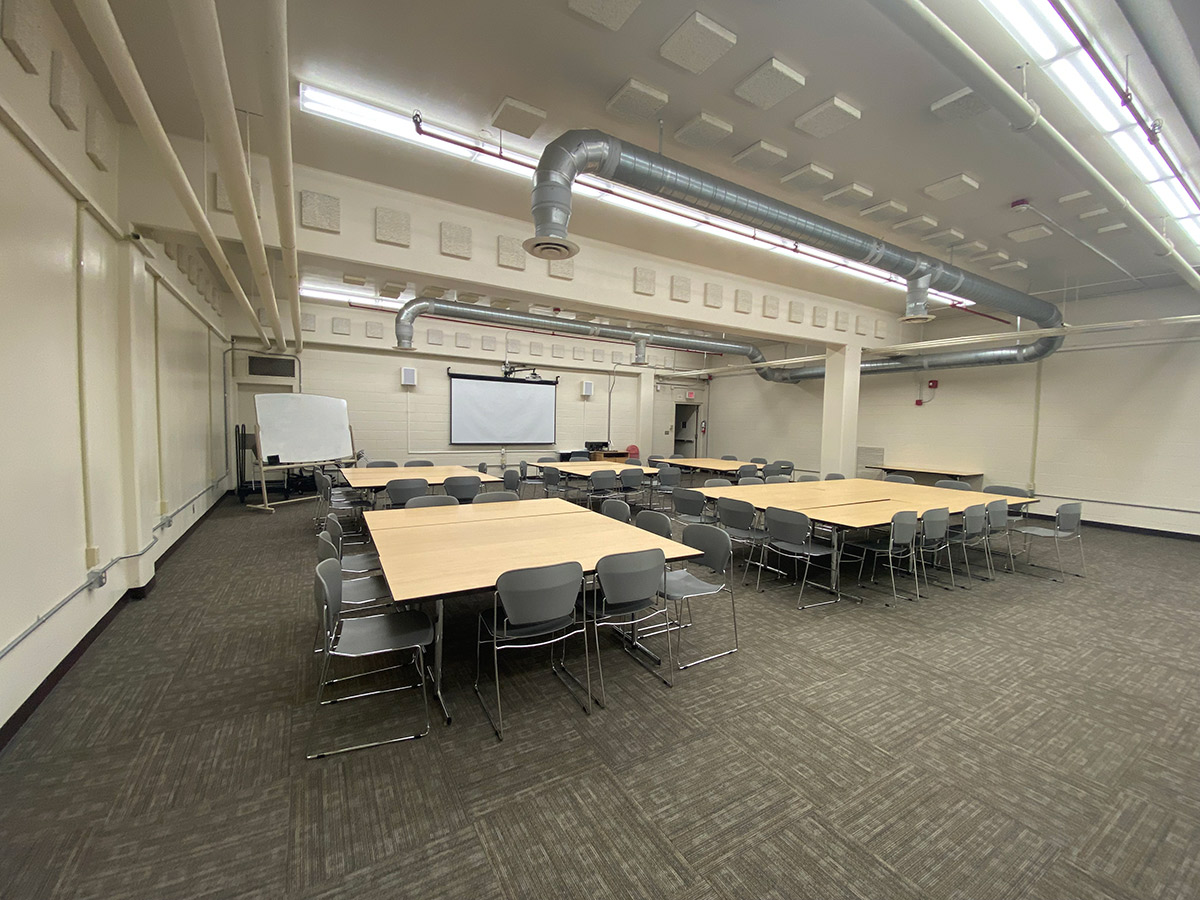 The whiteboard and seated desks of Wallace C-26.