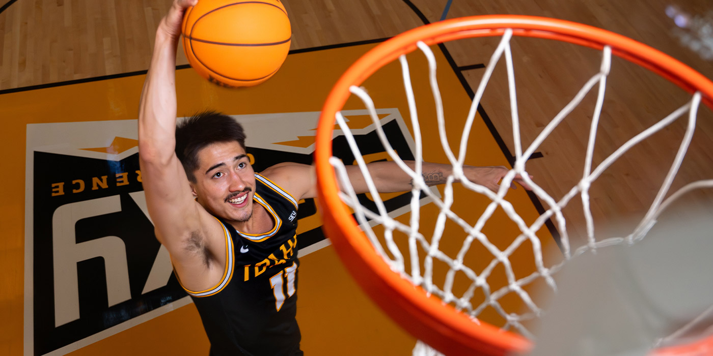 A view of Titus, dunking a basketball, from above the rim