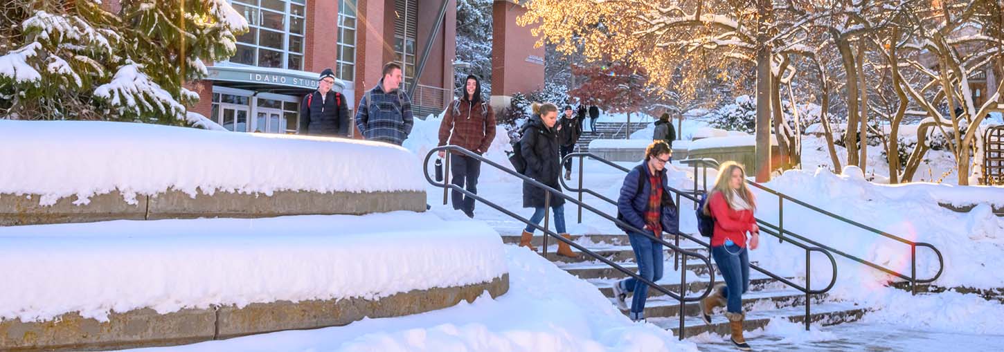 Students walking near the TLC during the winter.