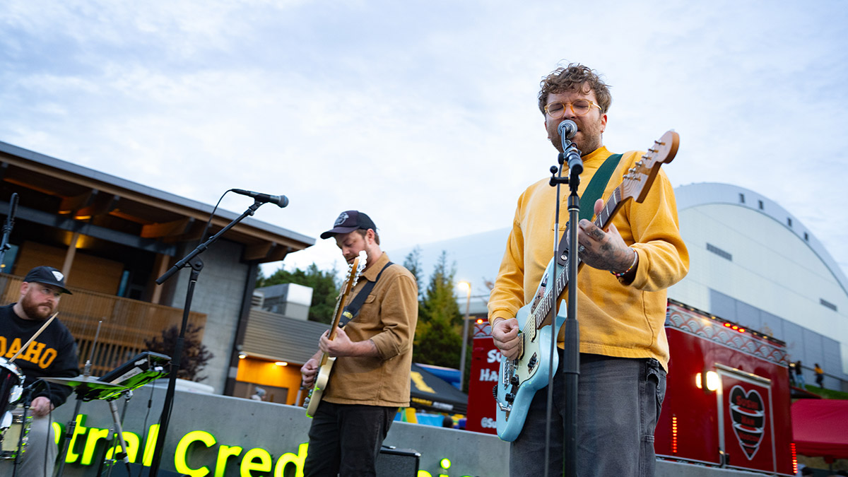 A band playing music in front of the Kibbie Dome
