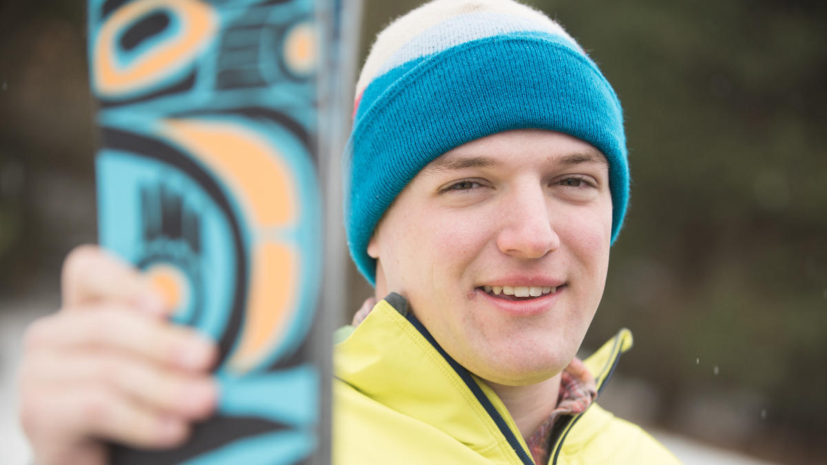Student holding skis