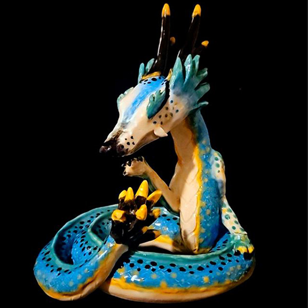 Sculpture of a blue and yellow dragon