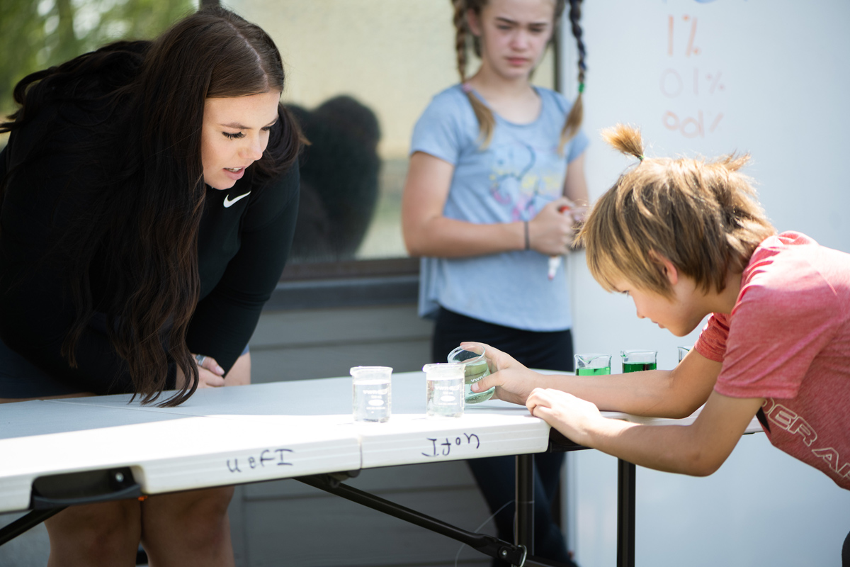 Emma Arman teaches students about the water cycle.