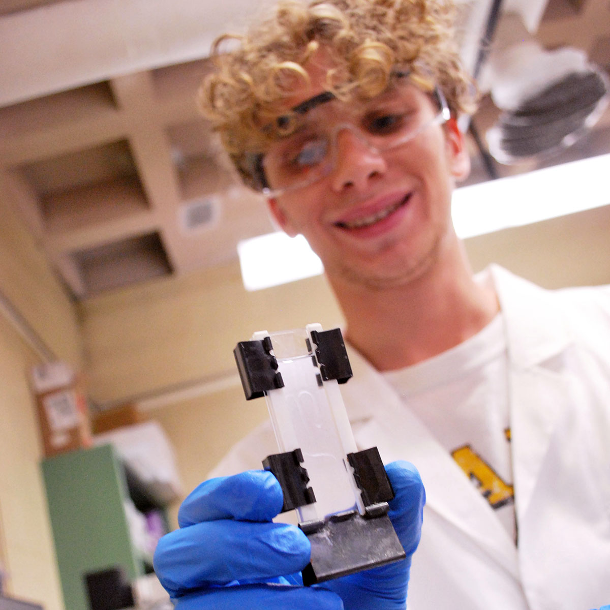Will Schaal, student holding part of science project