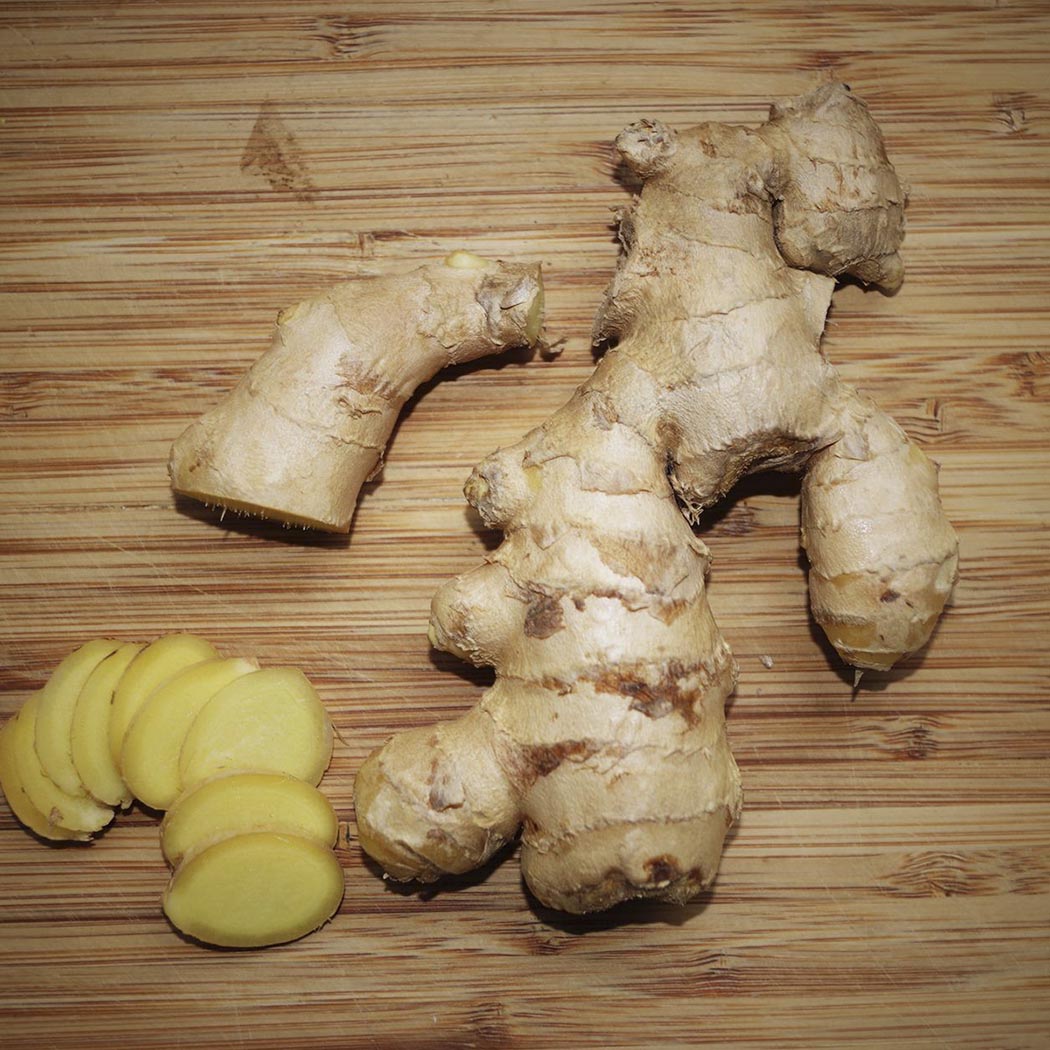 Ginger root, some sliced