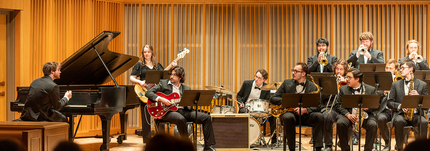 Band on stage with Mason Oyler on right-hand side at piano.