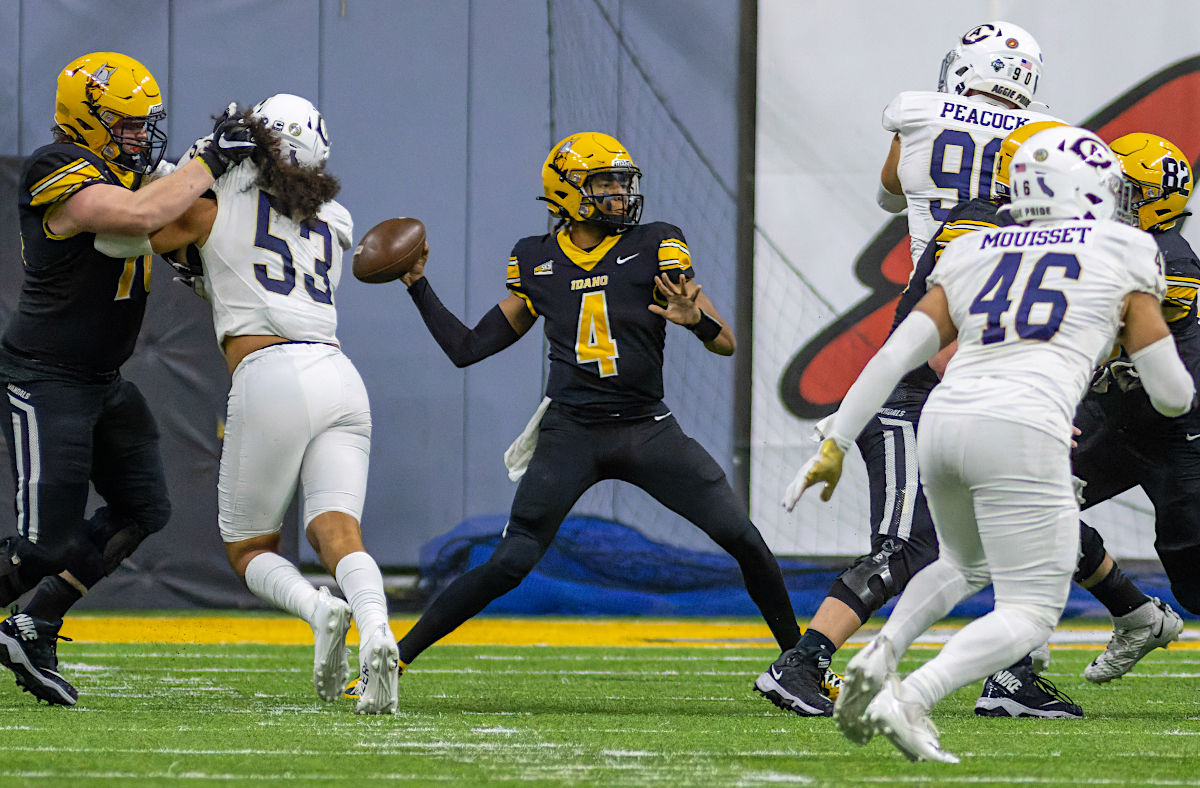 Football action shot with QB about to throw ball